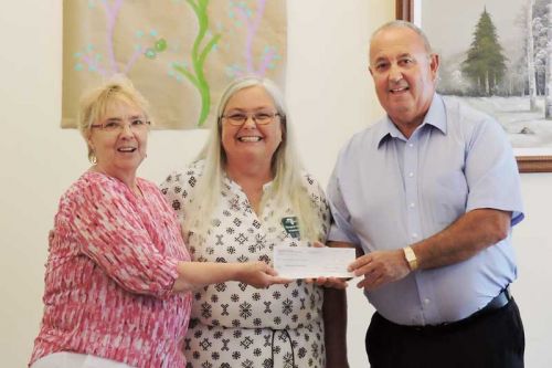 Frances Smith, Mayor of Central Frontenac presents Pine Meadow Nursing a cheque for $12,500 towards the window project